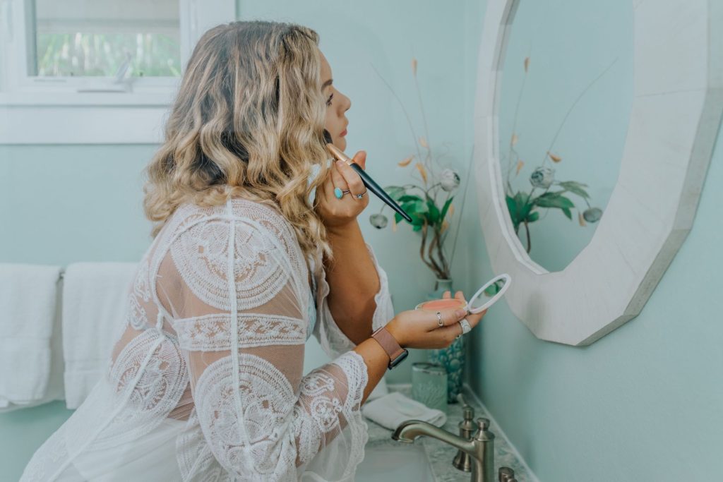 Woman putting on makeup
