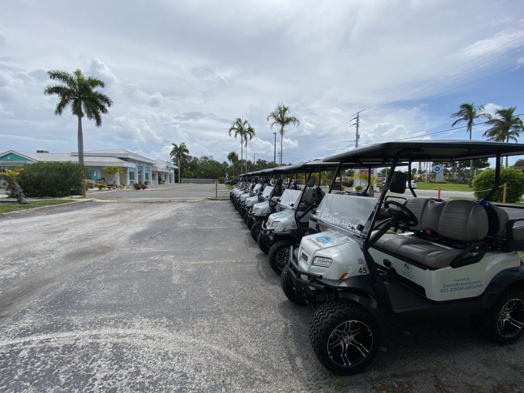 golf carts parked in a line