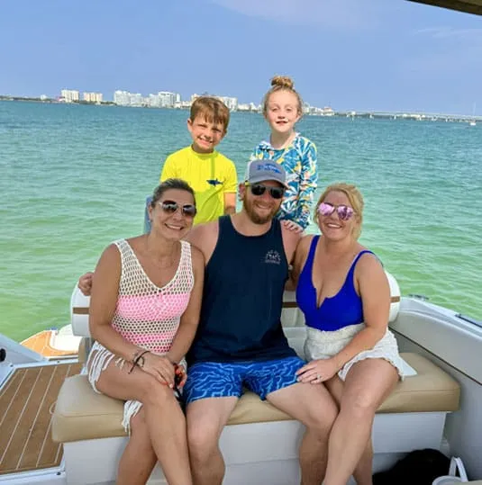 family on boat charter