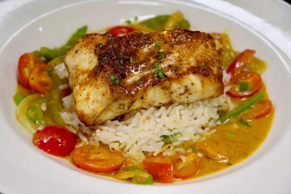 seafood dish with rice and tomatoes