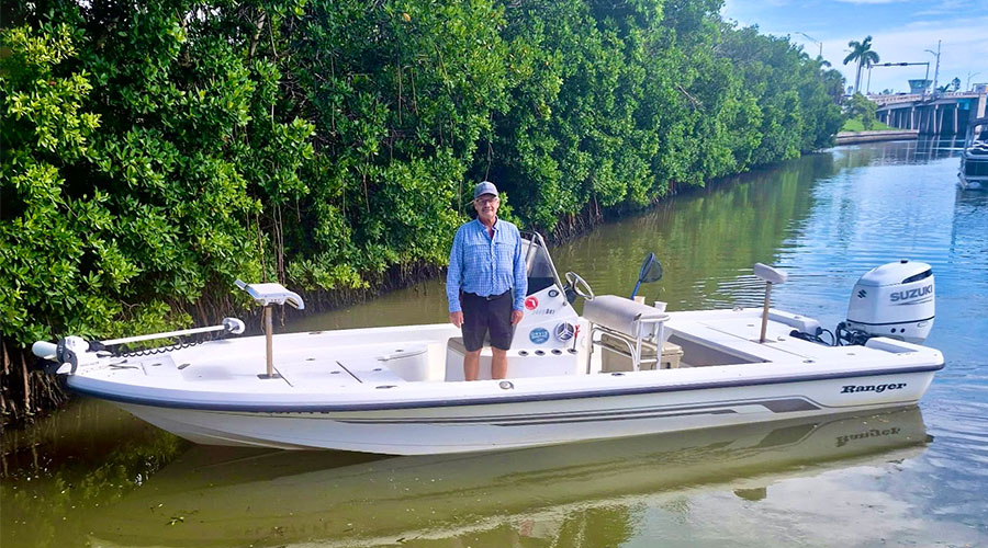 captain standing on his fishing boat