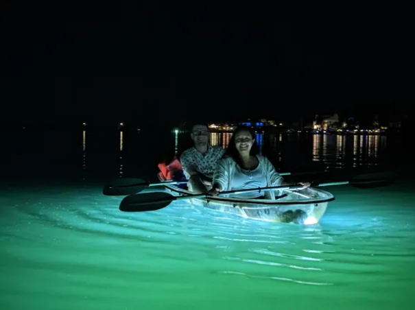 clear kayaks at night